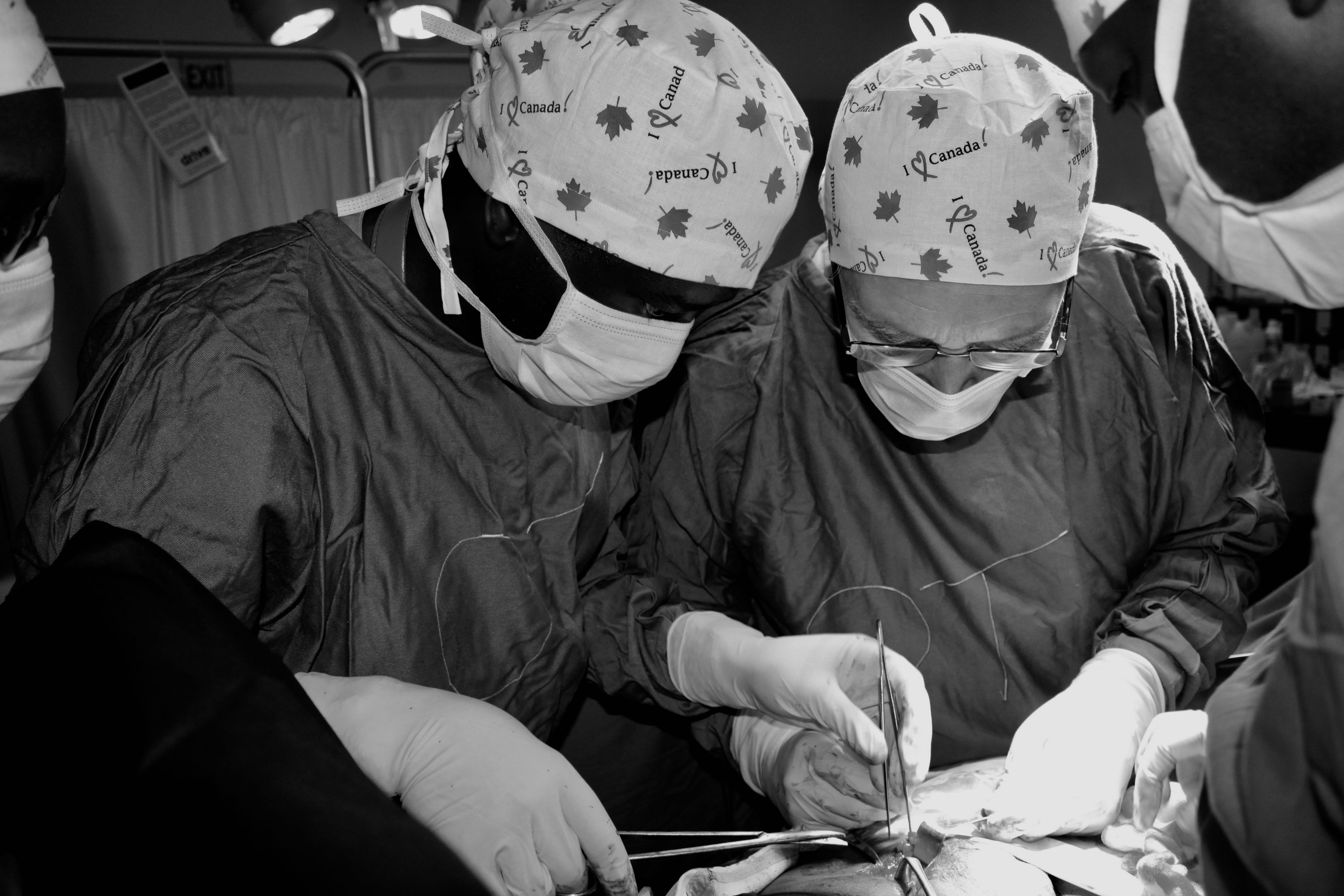 Two doctors preforming surgery