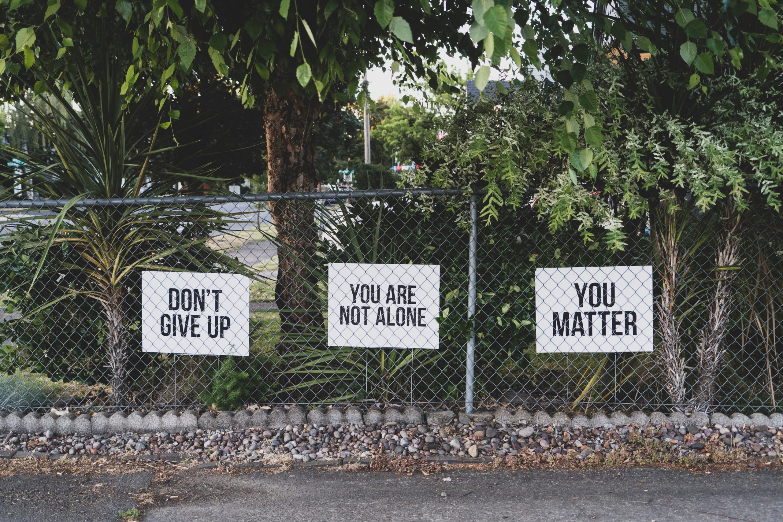 signs saying dont give up and you matter